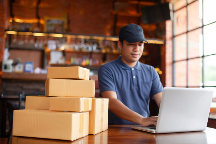 Entrepreneur working with packaging startup small business.